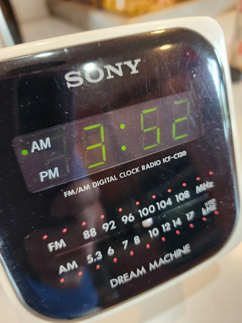 Vintage Sony White Clock Radio with Black Display and Green LEDs
